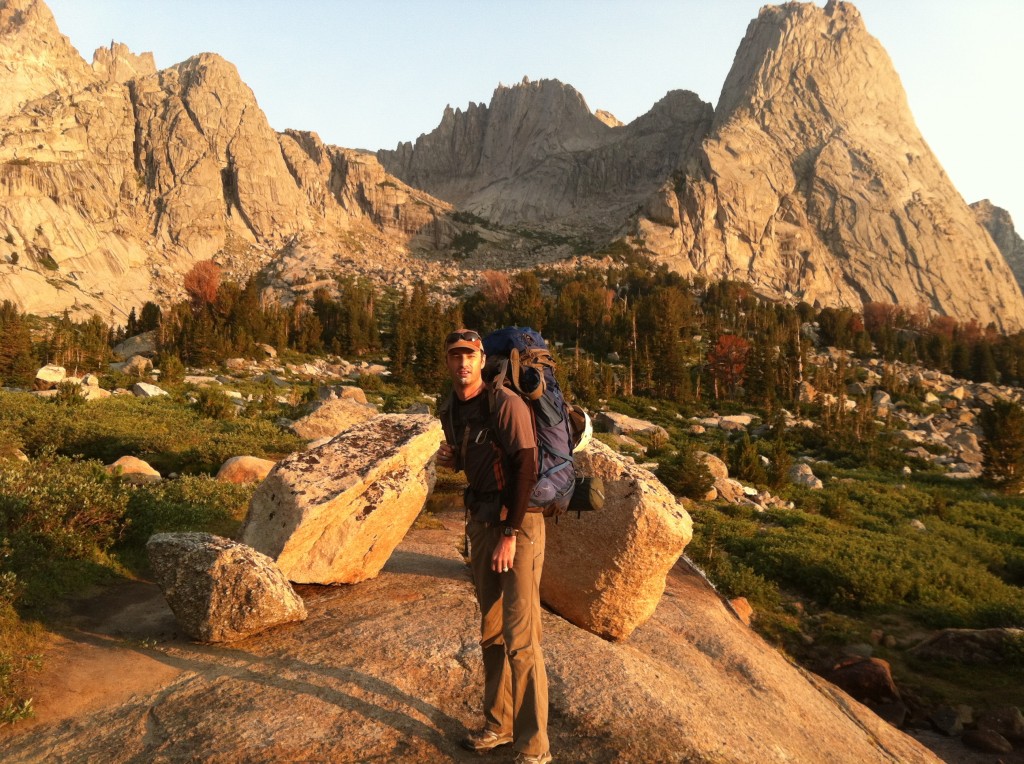 The author in a place where a high income does you no good at all- Bonus points if you can identify the four peaks in the photo