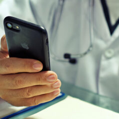 Doctor looking at a phone