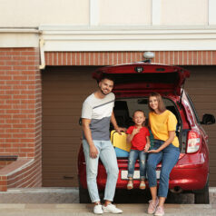 Family in front of garage